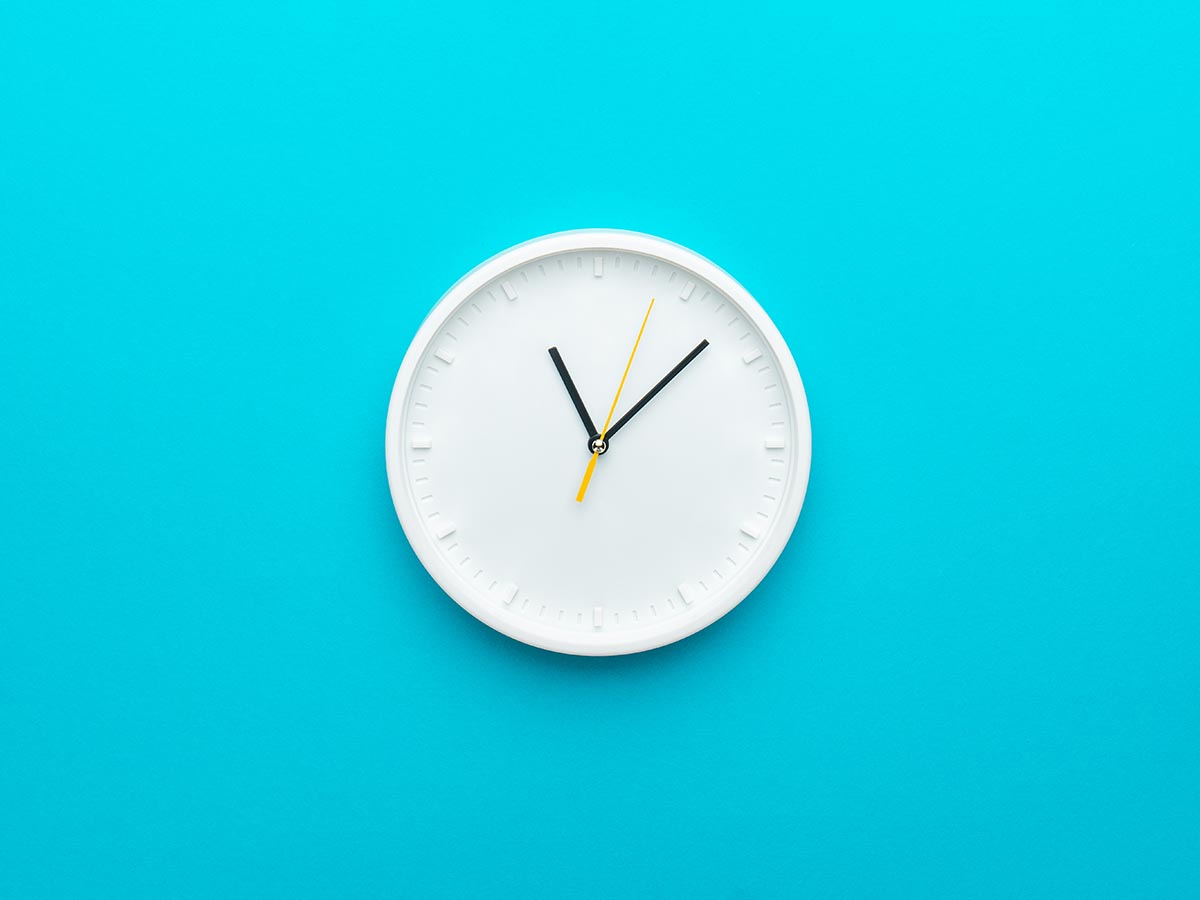 A clock on a colorful background.