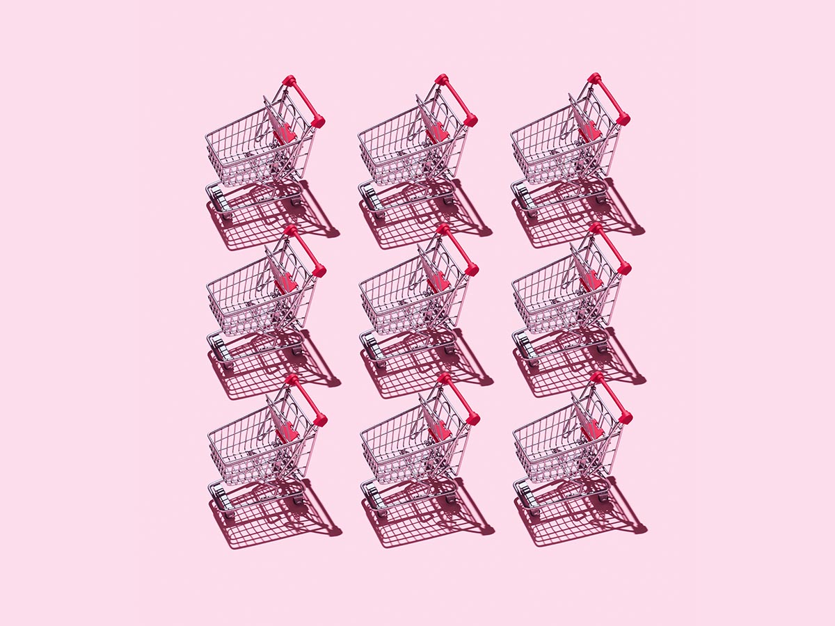 Nine small shopping carts on a pink background to indicate multiple store locations.
