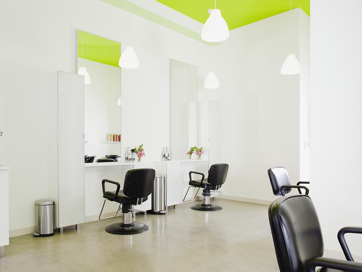 Several chairs at a hair salon.