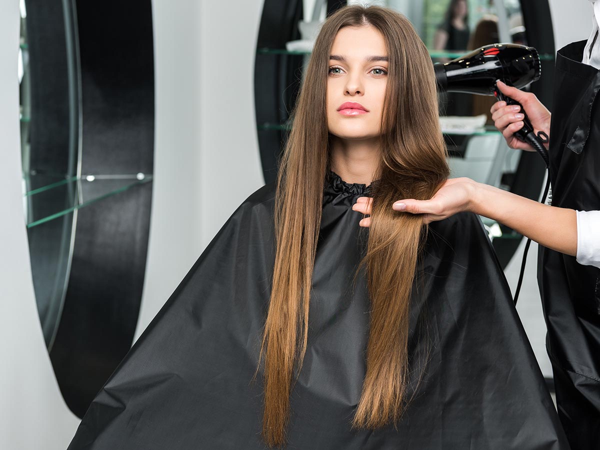 Woman with long hair at a hair salon.